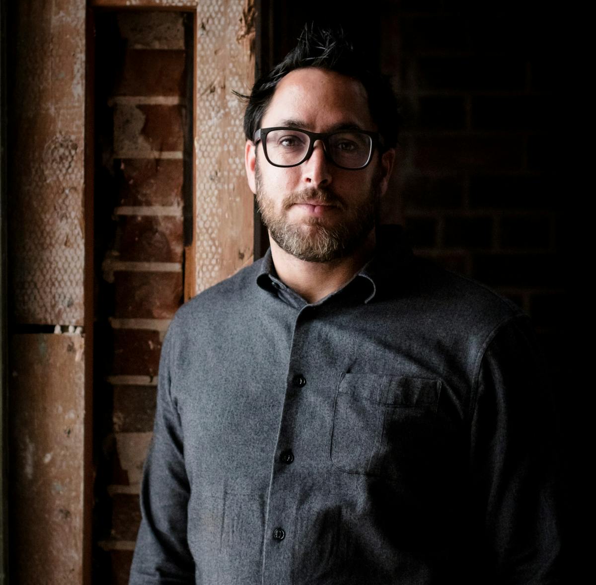 Christopher Kostow wearing glasses and smiling at the camera