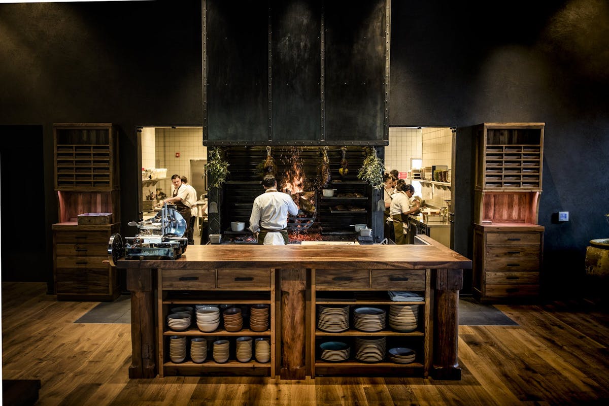 a kitchen with wooden cabinets and a window