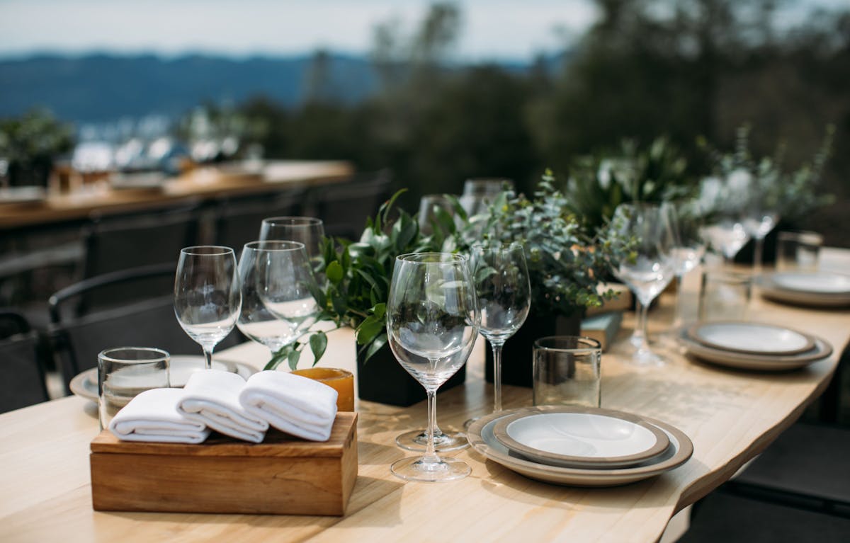 a table topped with glasses of wine