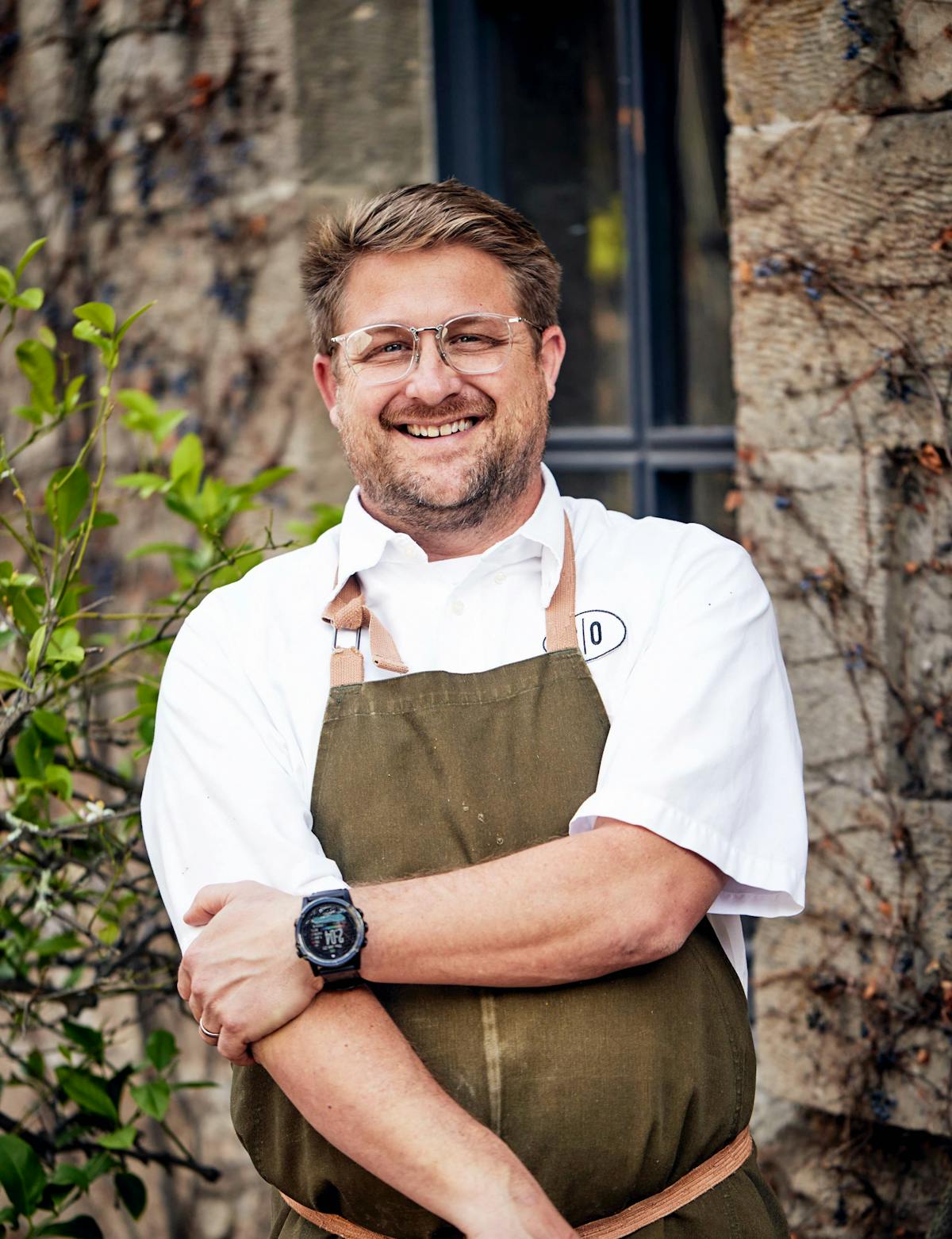 chef curtis di fede standing in front of a charter oak building