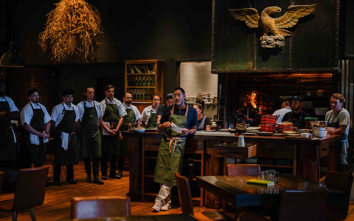 chef kostow at the charter oak hearth talking with staff