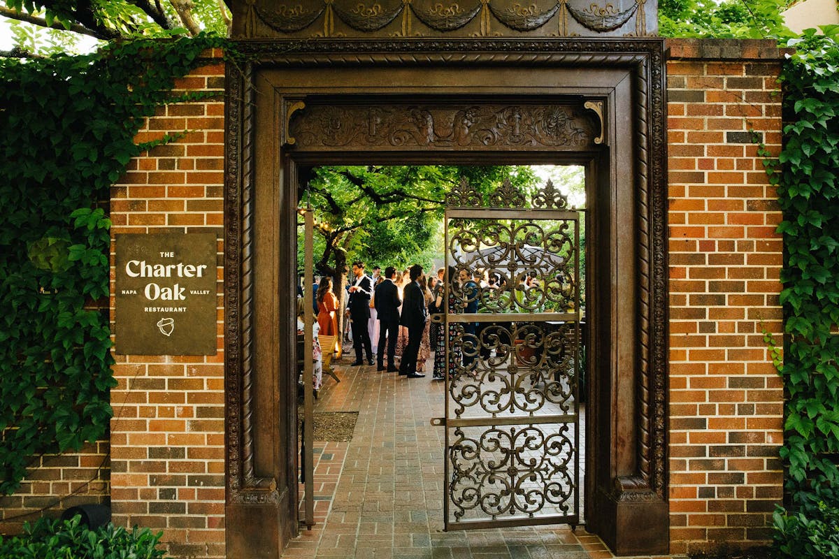 a group of people standing in the charter oak courtyard