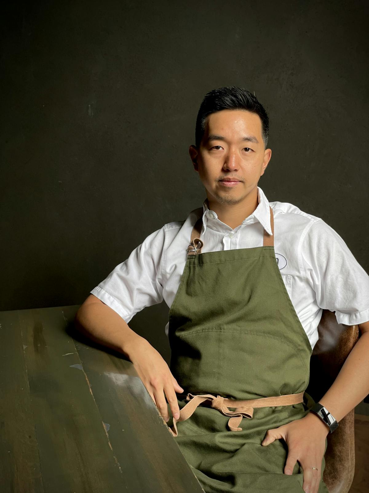 chef eddie lee sitting in a chair