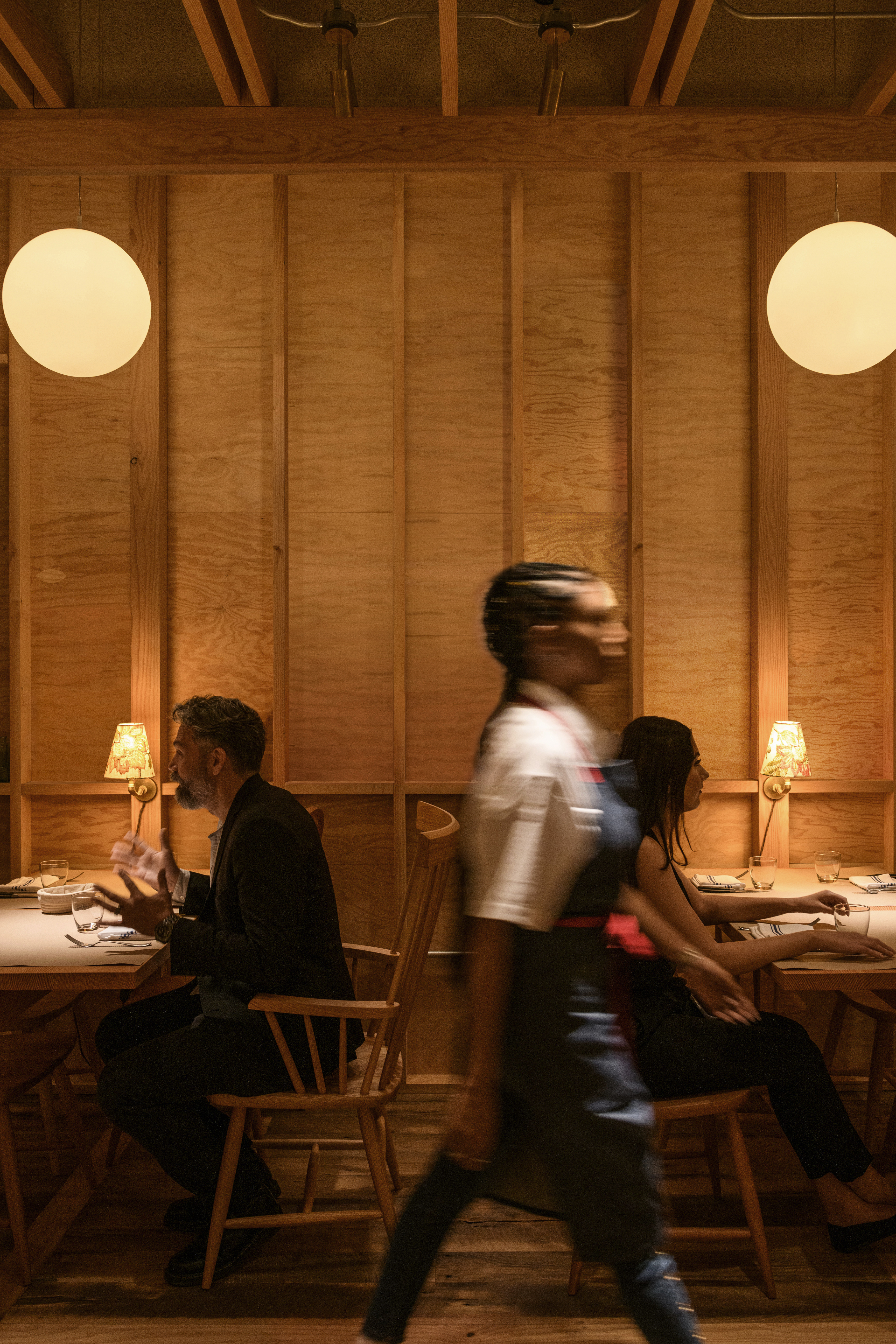 a group of people sitting at a table in a room