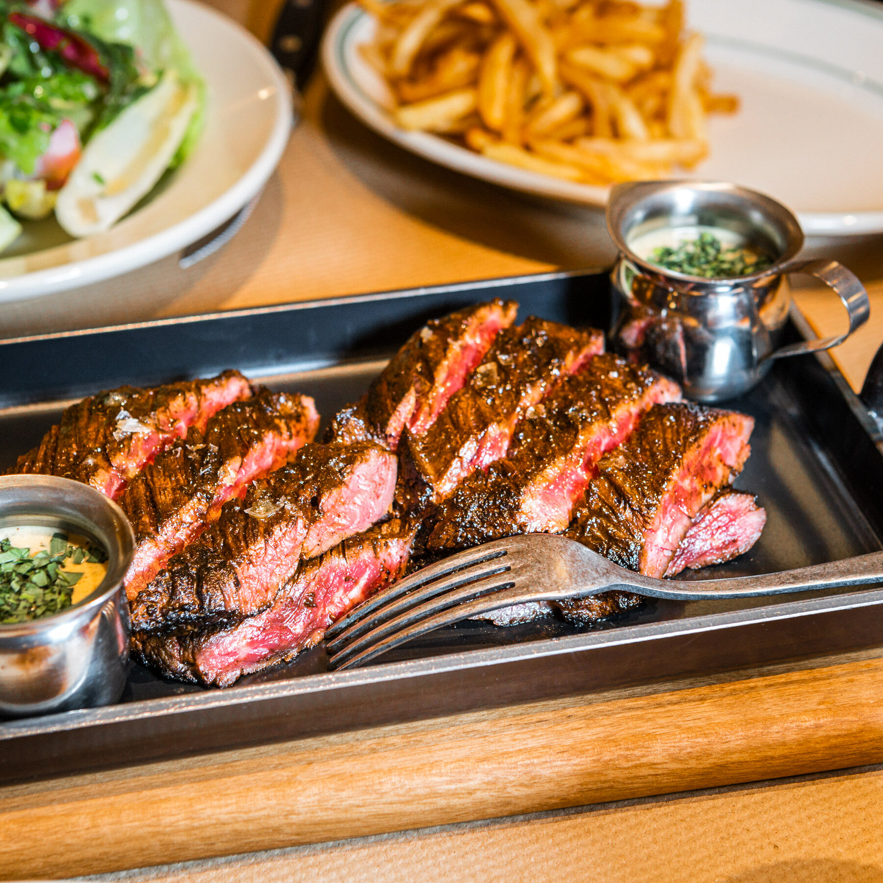 a plate of steak and salad