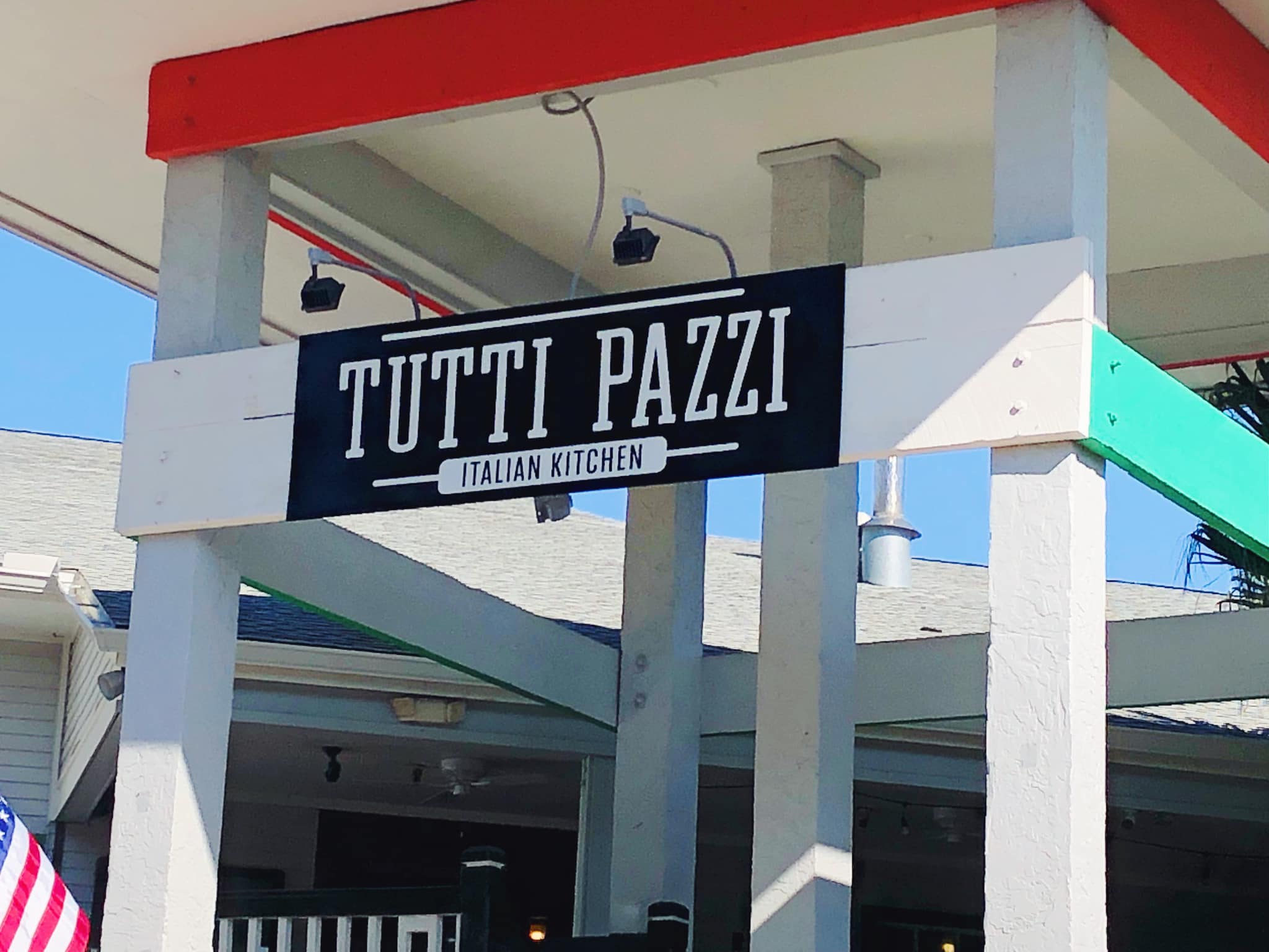 a sign in front of a building