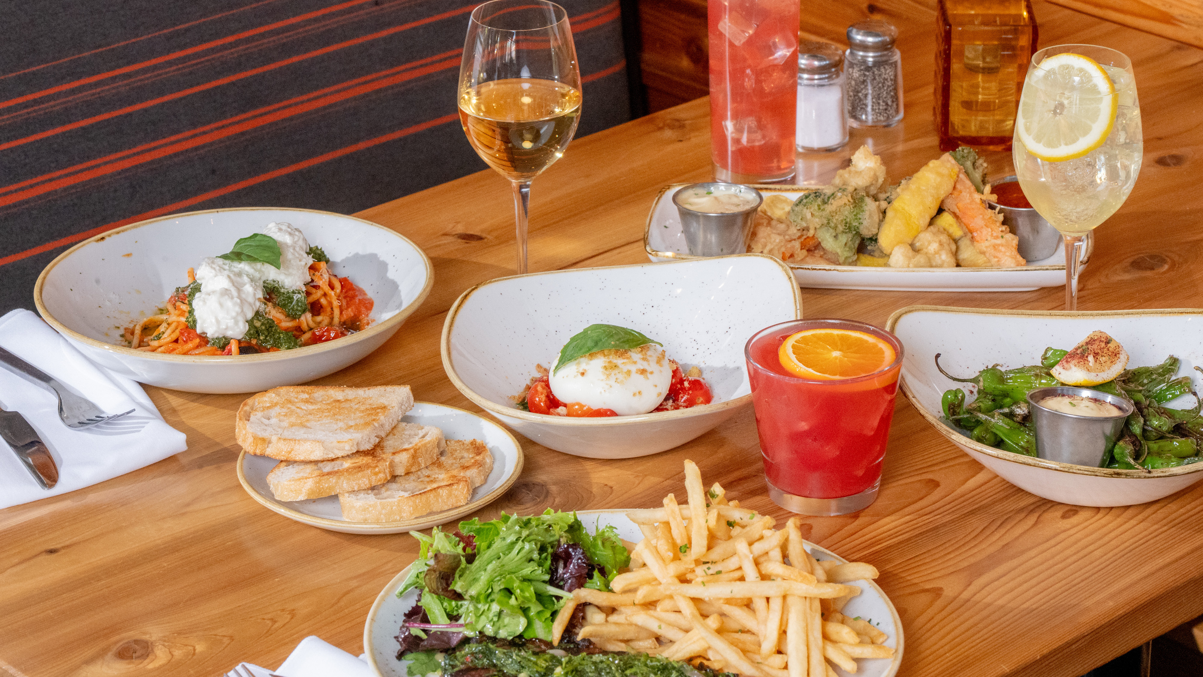 a table with plates of food and drinks