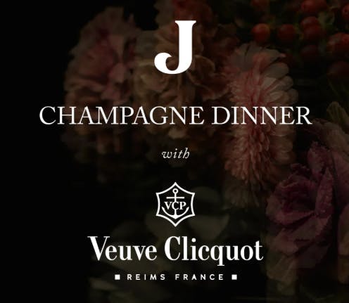 Flowers with veuve clicquot logo and title Champagne Dinner with Jekyll Logo on top