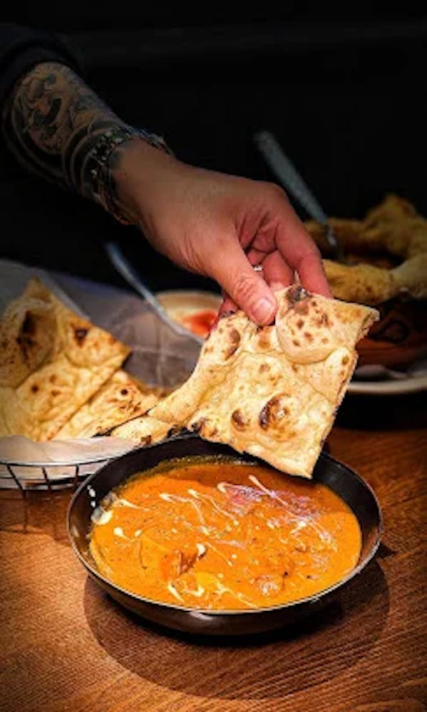 a person holding a plate of food