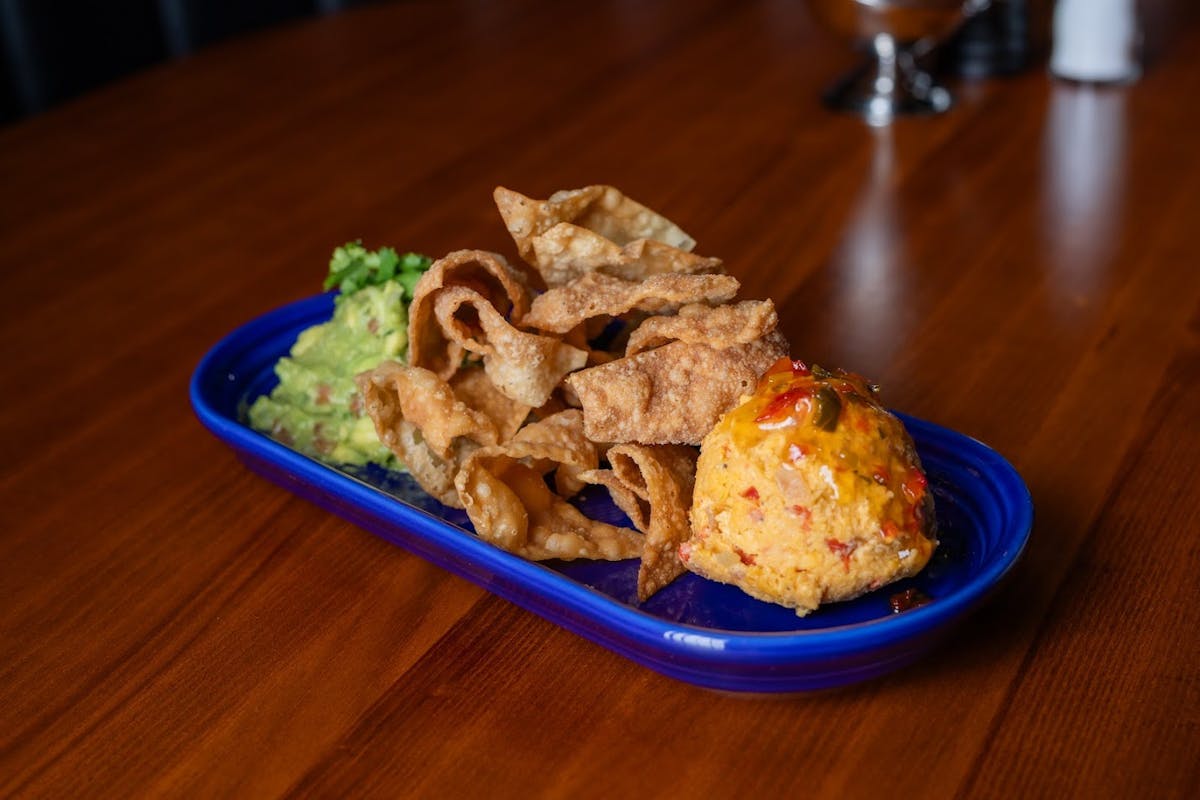 a plate of food sitting on top of a wooden table