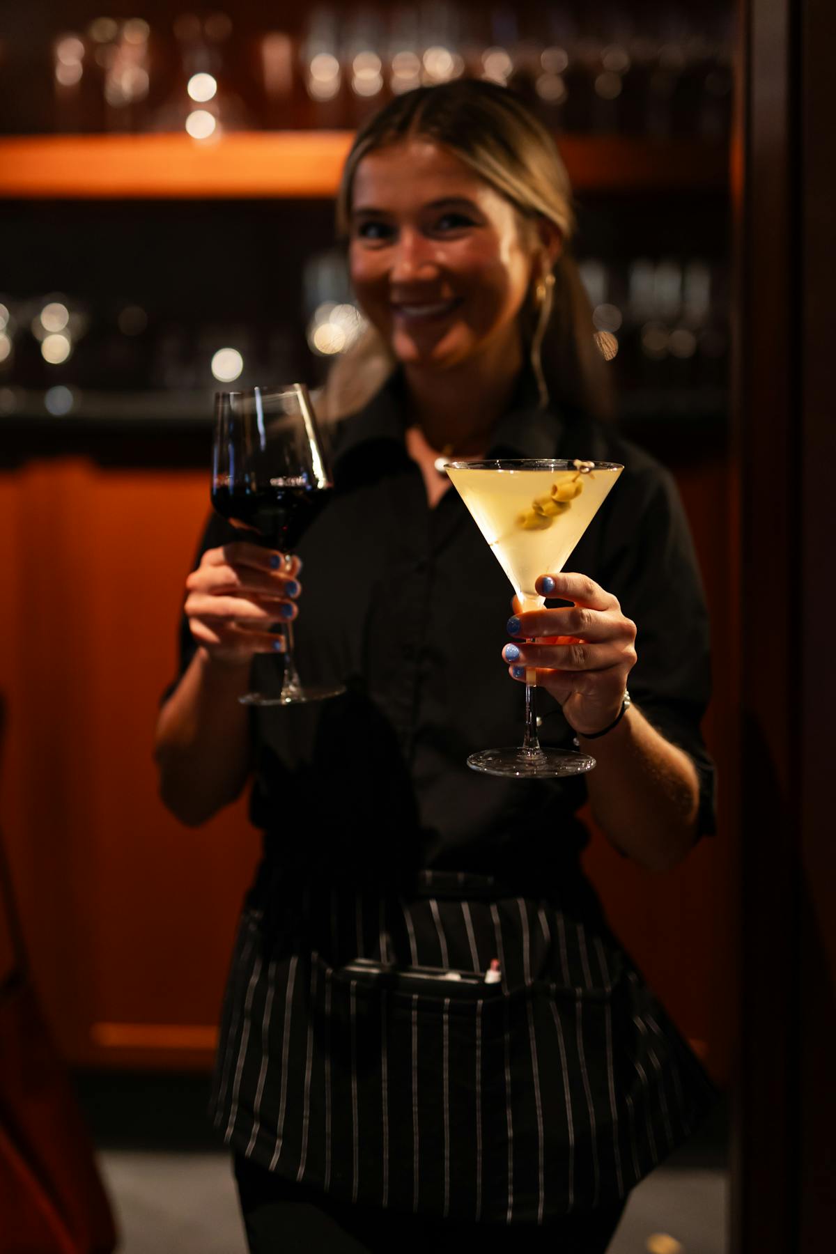 a woman holding a wine glass