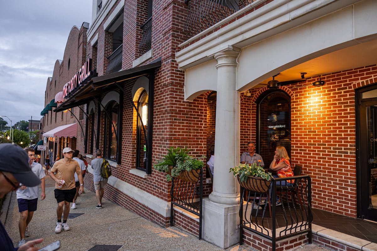 a group of people standing in front of a building