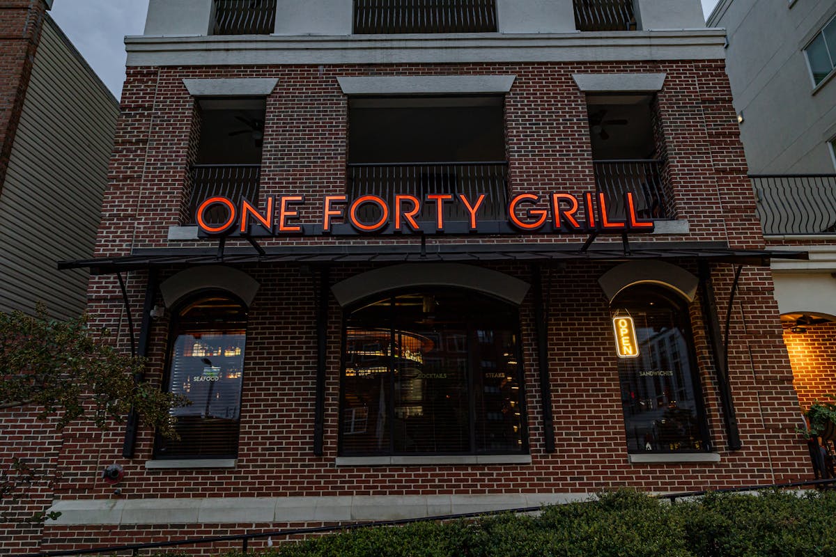 a sign in front of a building