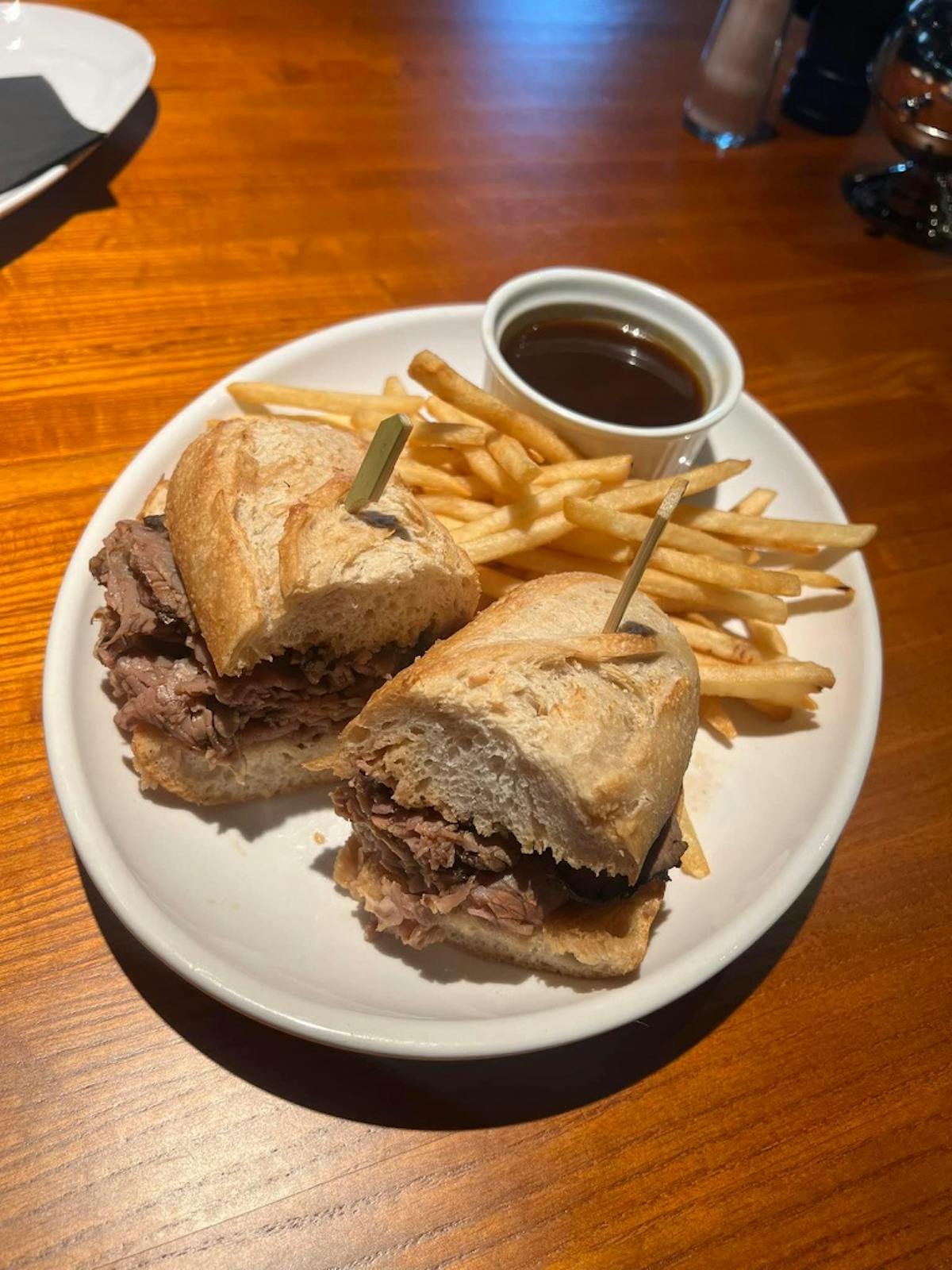 a plate with a sandwich and a cup of coffee