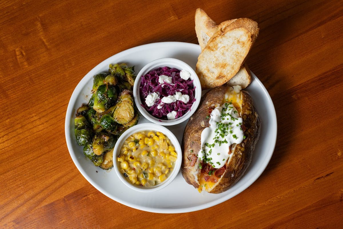 a bowl of food on a plate on a table