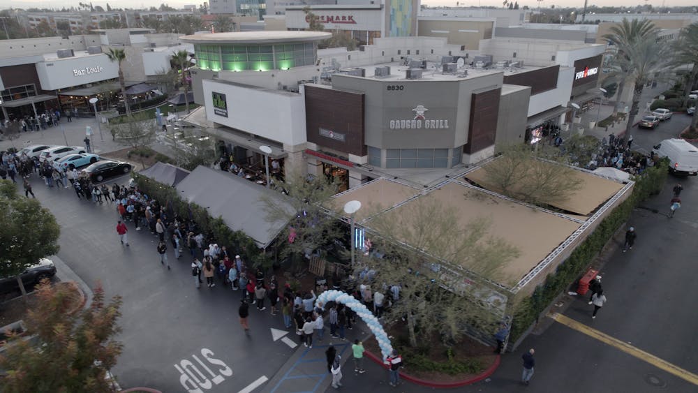 a view of a city street filled with lots of traffic