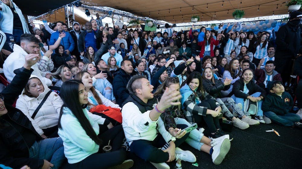 a group of people standing in front of a crowd
