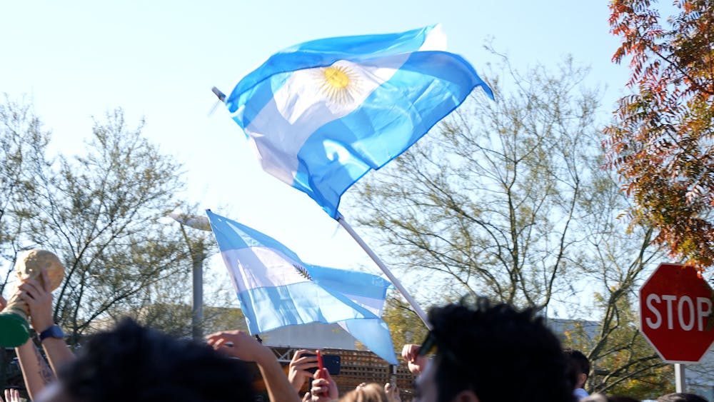 a person flying through the air while holding an umbrella
