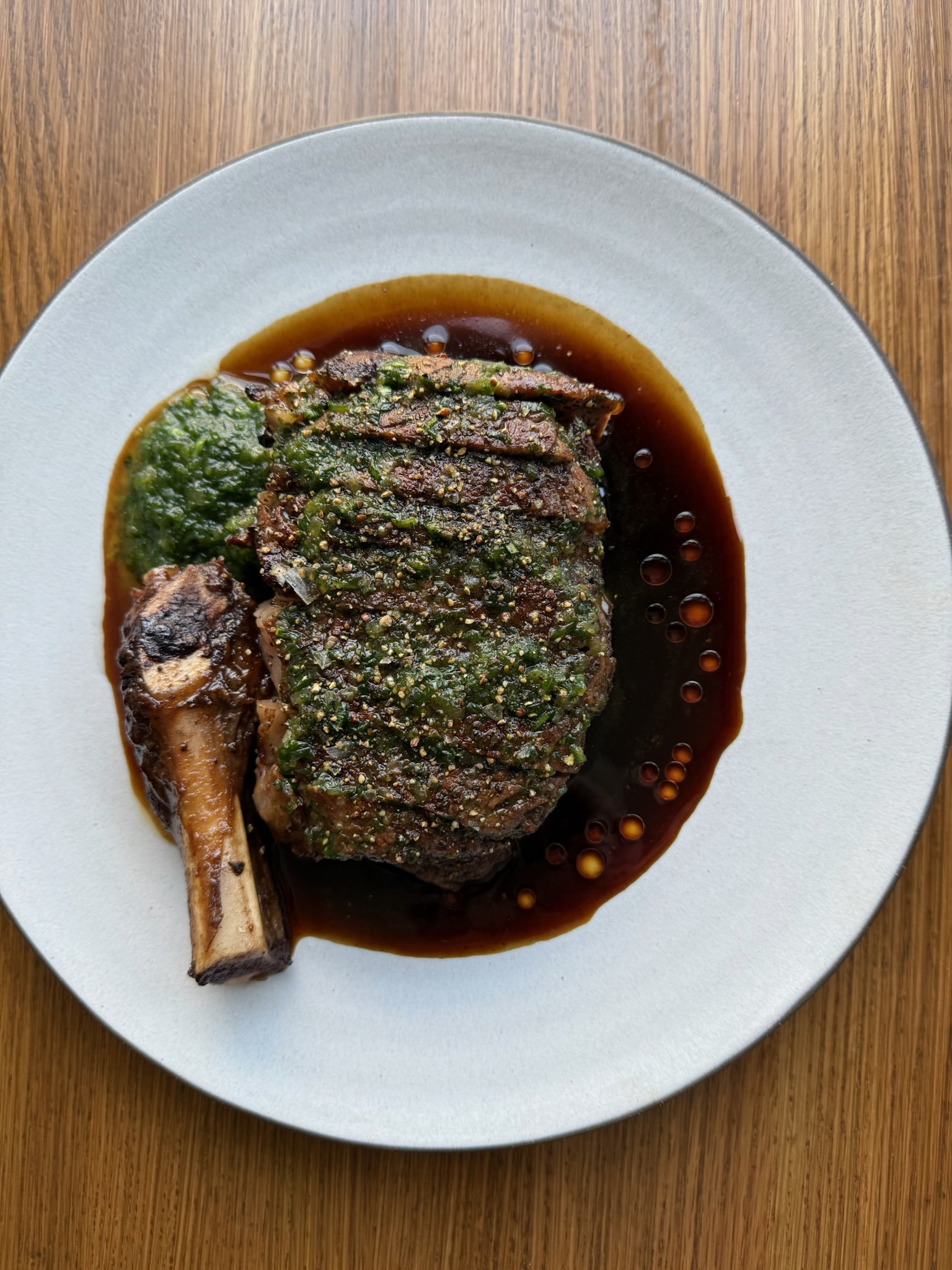 a plate of food sitting on top of a wooden table