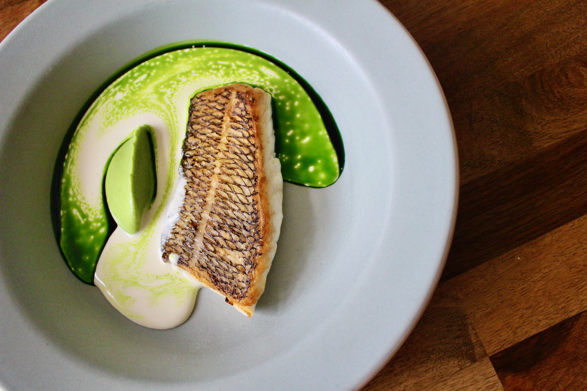 a banana sitting on top of a green plate