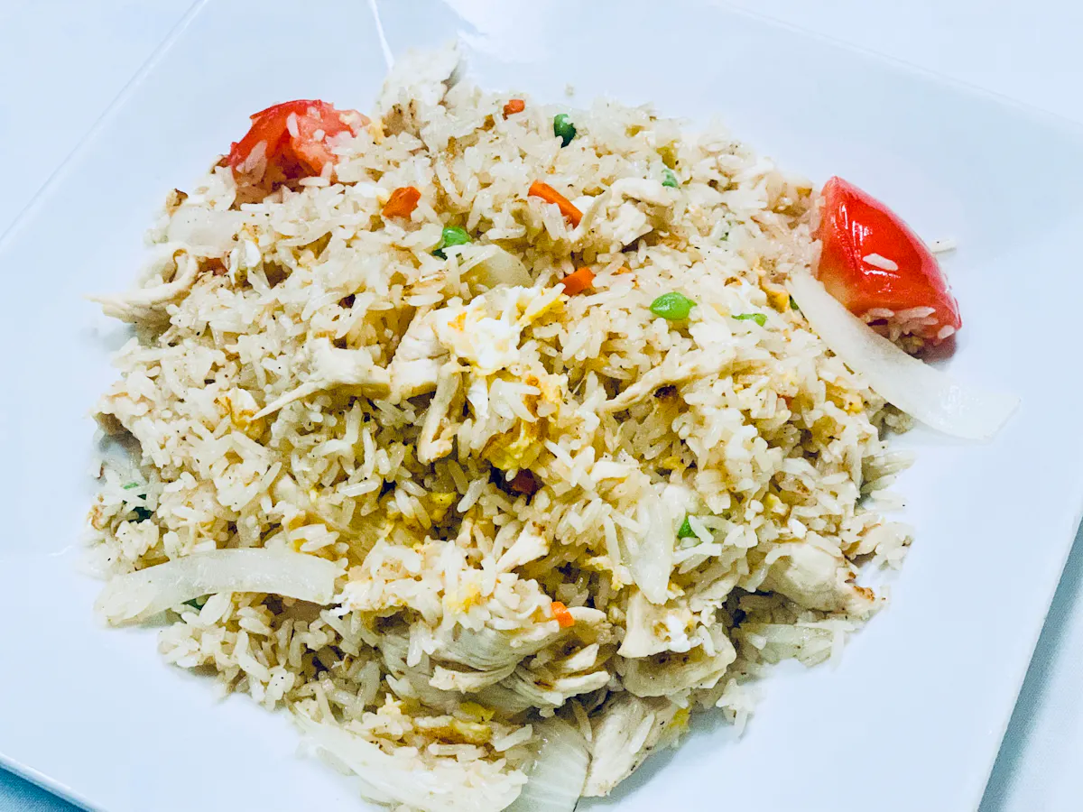 a plate of food with rice and broccoli
