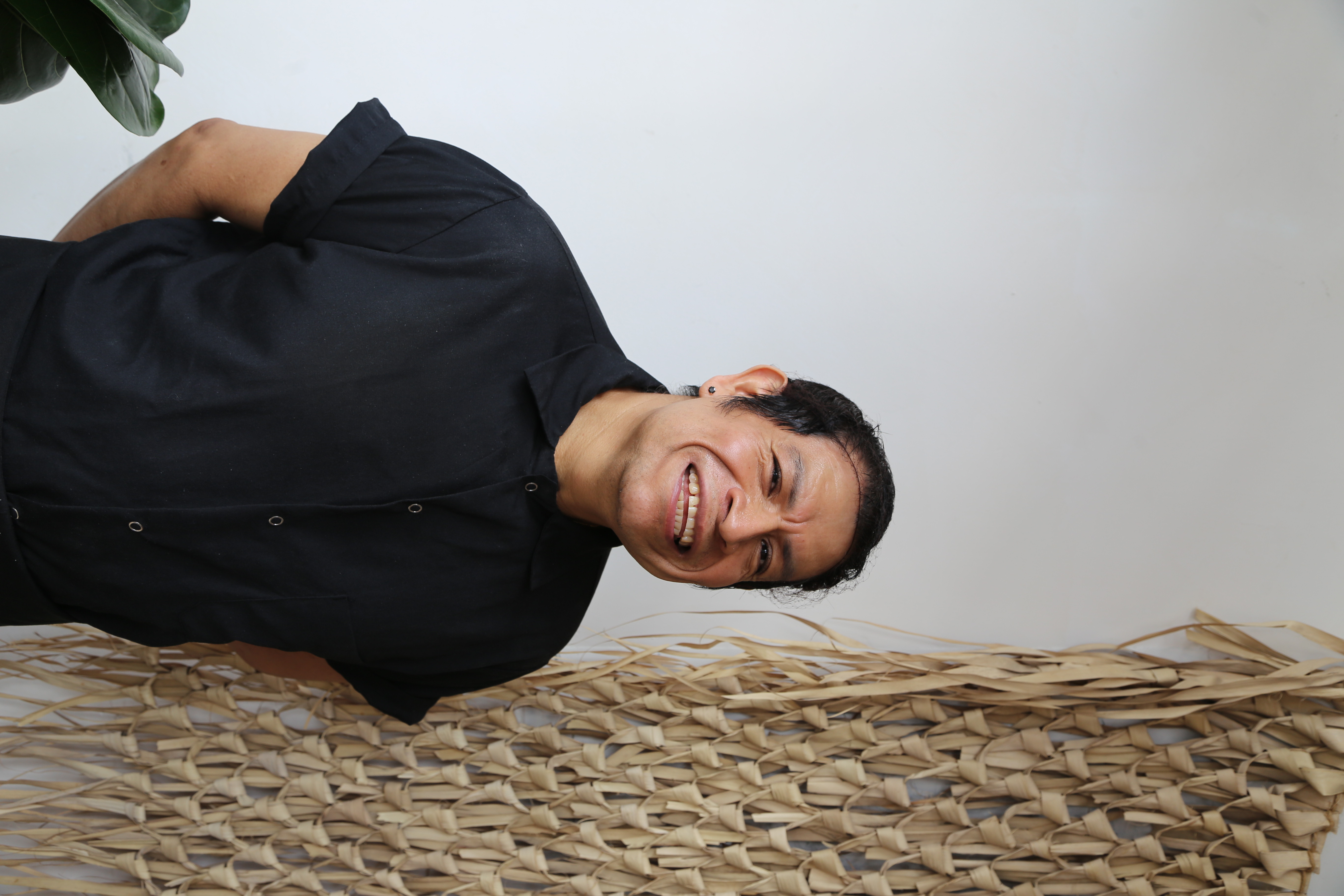 a man standing in front of a wall