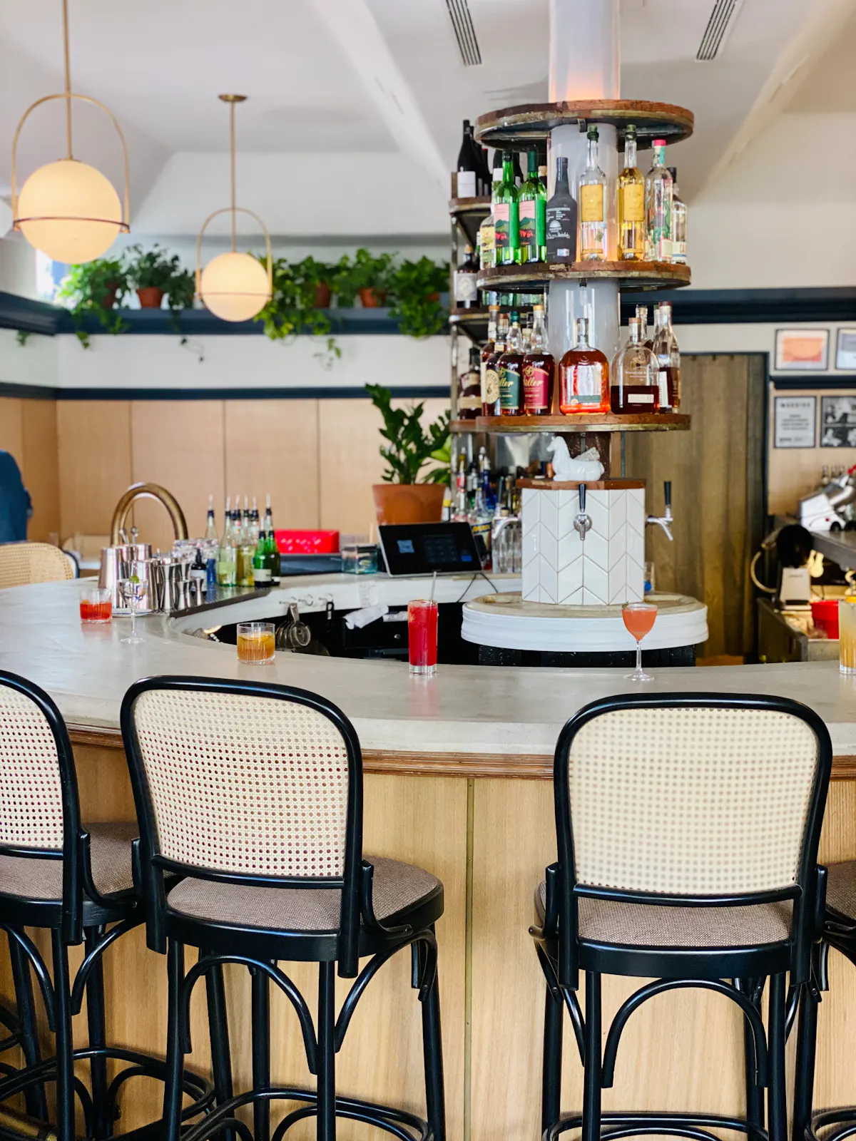 a kitchen area with a desk and chair in a room
