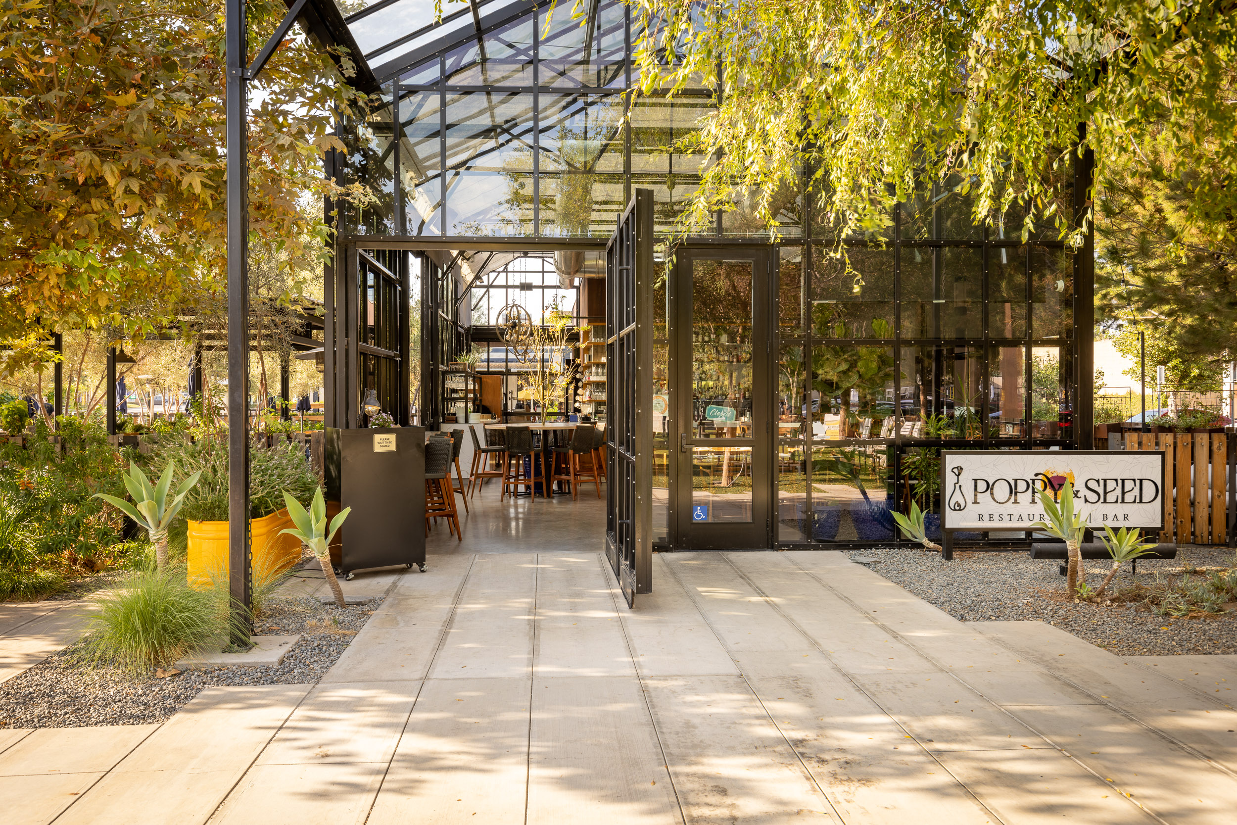 a sidewalk sign with a building in the background