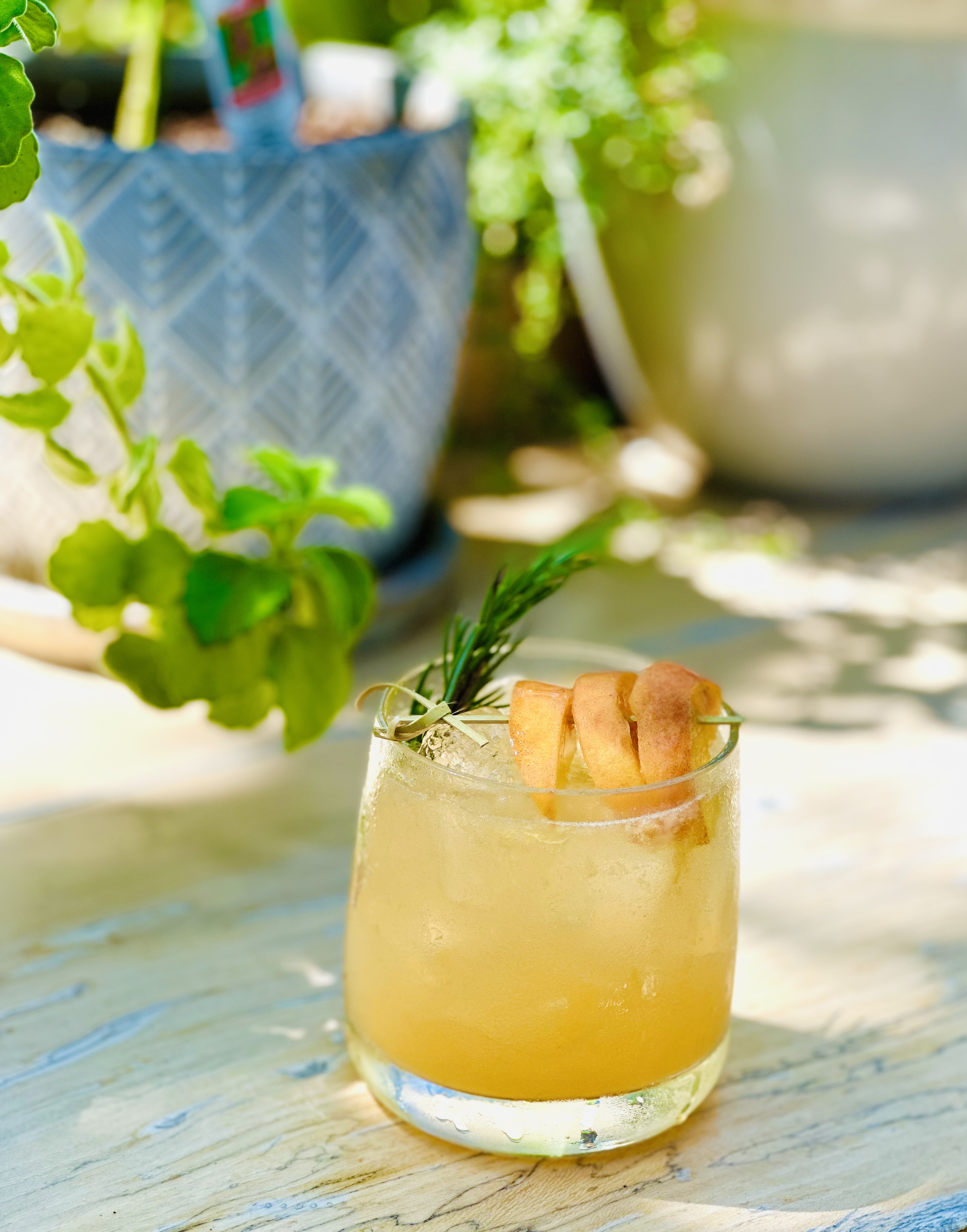 a glass of orange juice on a table