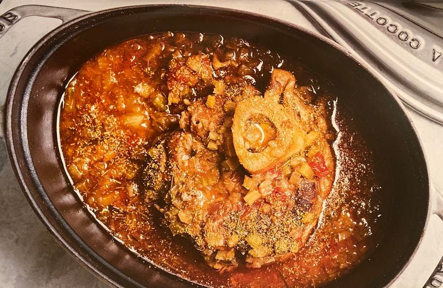 a pizza sitting on top of a pan on a stove