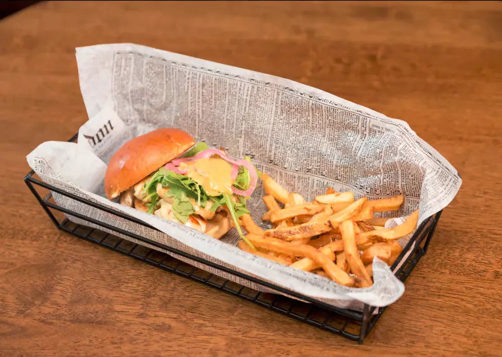 a sandwich sitting on top of a wooden table