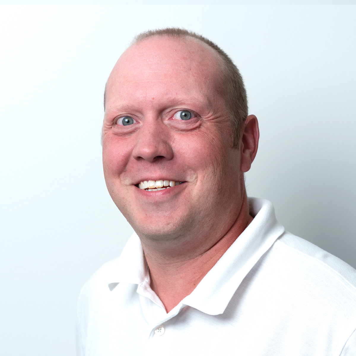 a man smiling for the camera