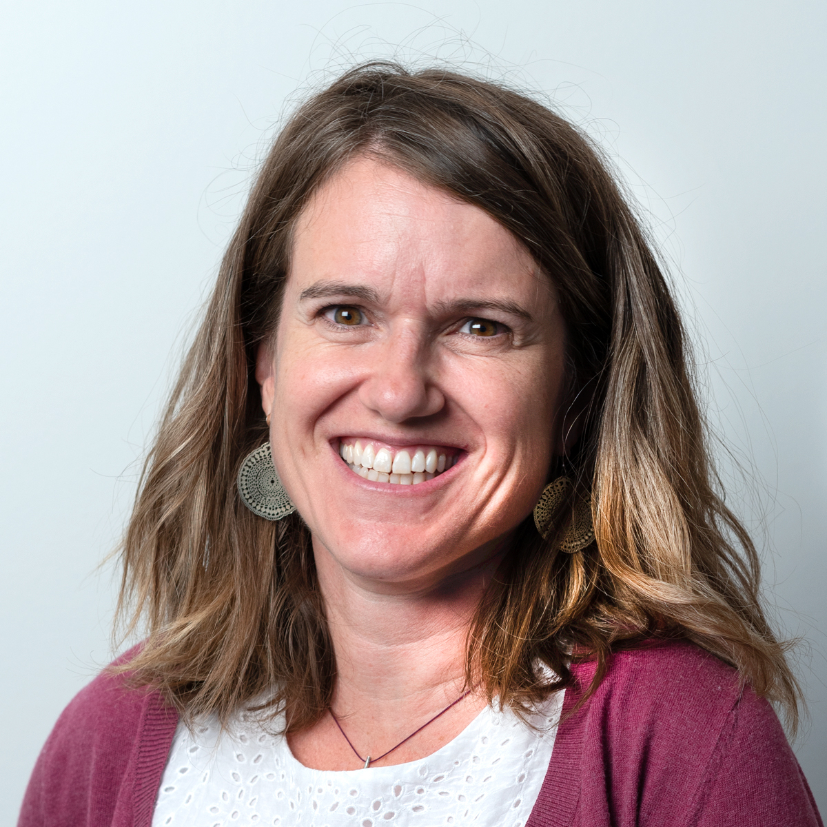 a woman smiling for the camera