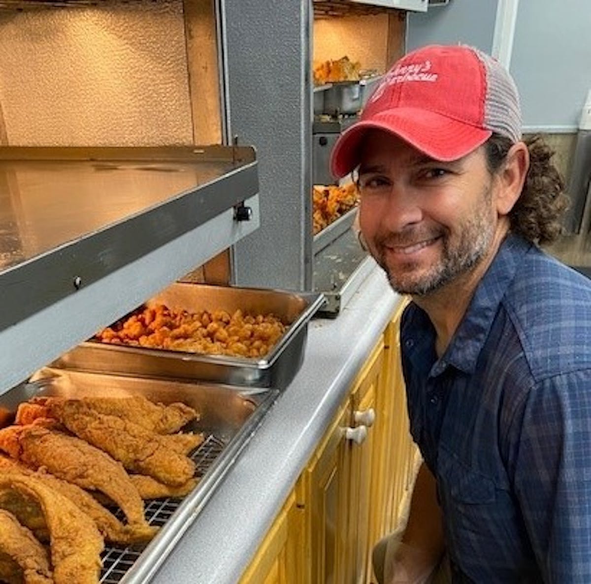 a man preparing food inside of it