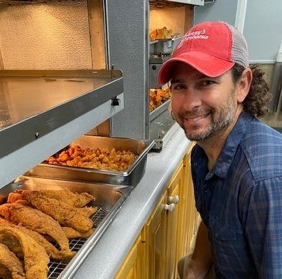a man preparing food inside of it