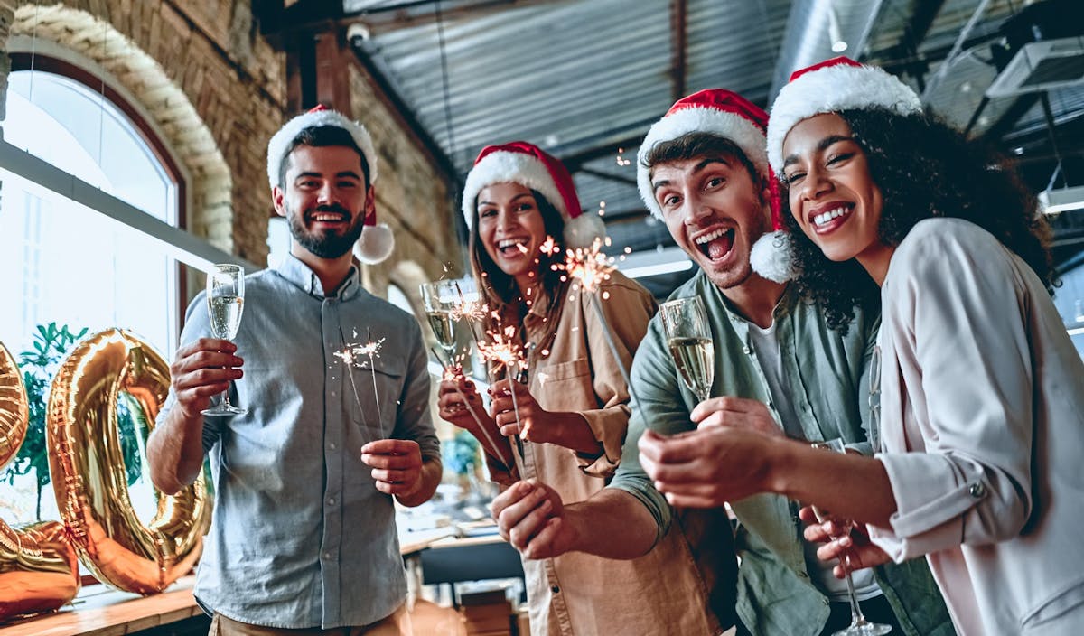 a group of people holding wine glasses