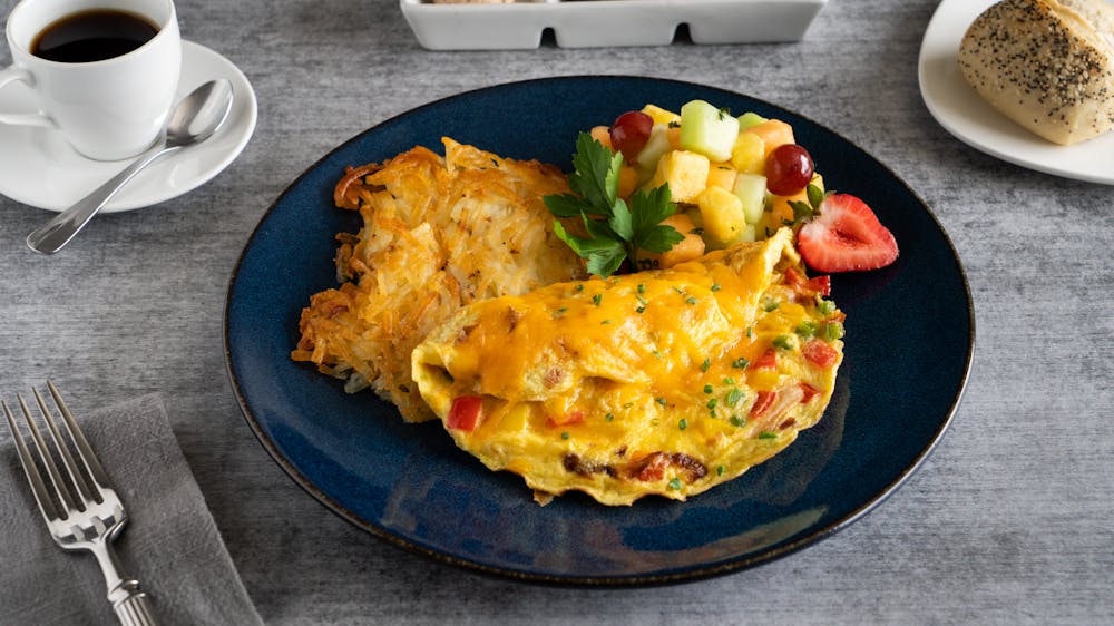 a plate of food and a cup of coffee