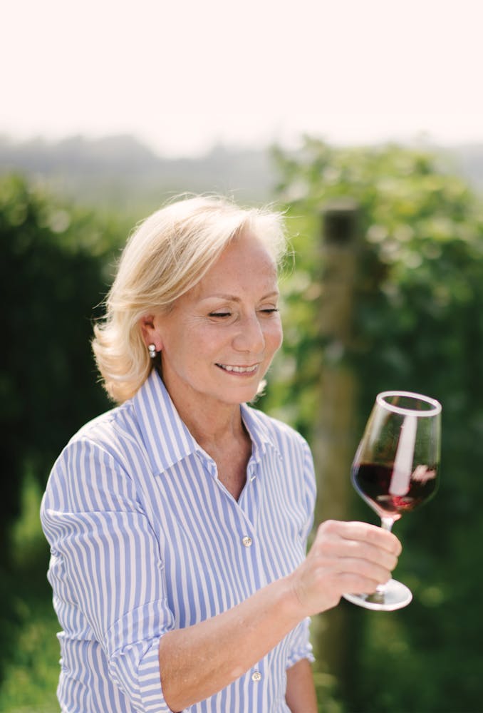 a person holding a wine glass