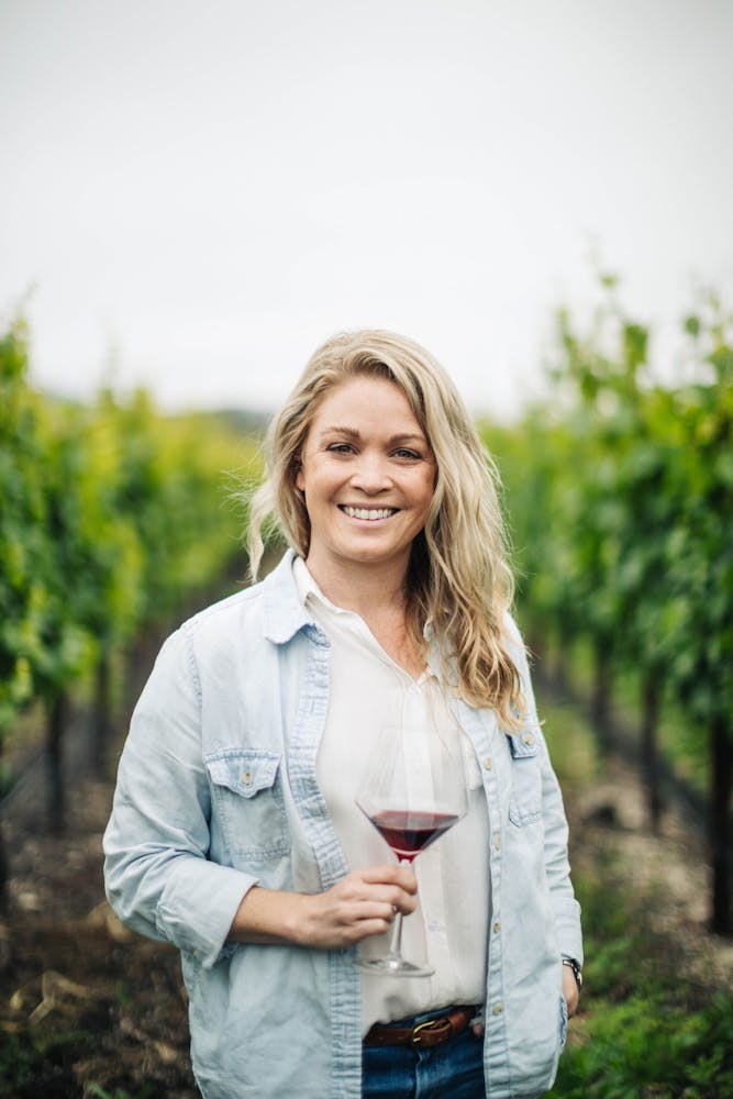 a woman holding a wine glass