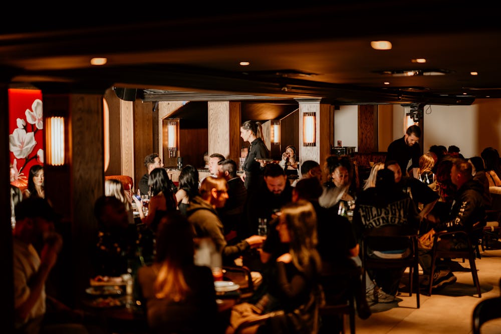 a group of people in a bar