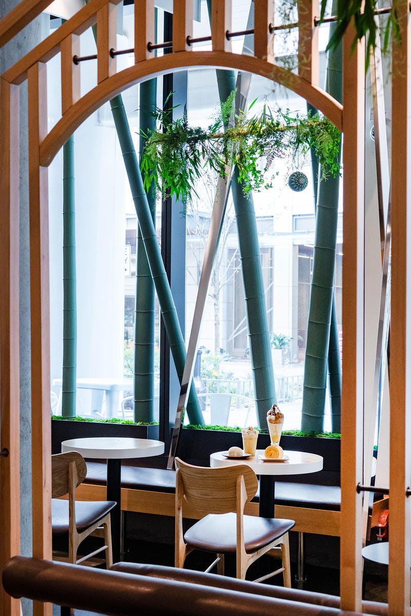 a dining room table in front of a window