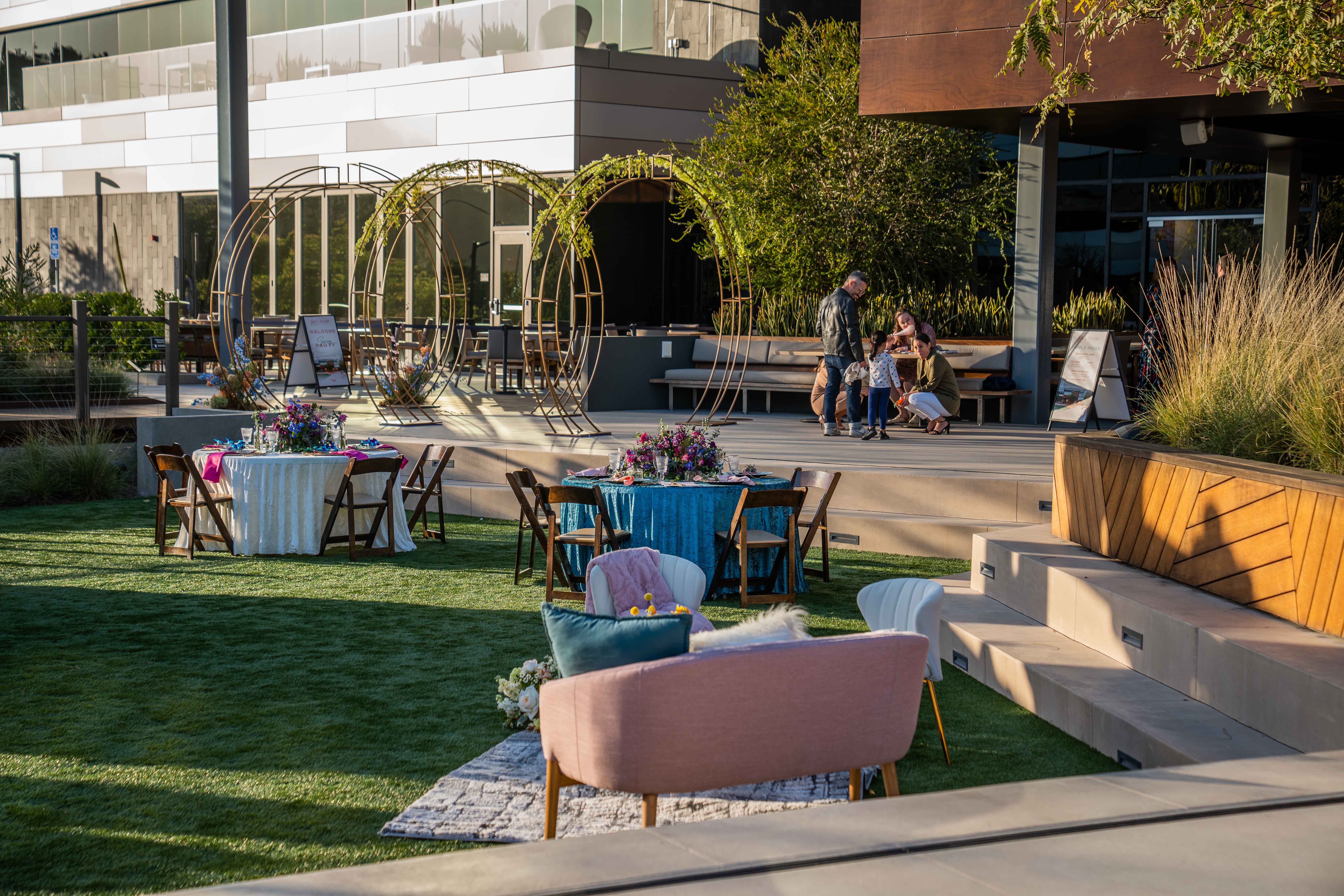 Indoor-outdoor event space opening onto the lawn at Joya Kitchen in La Jolla.
