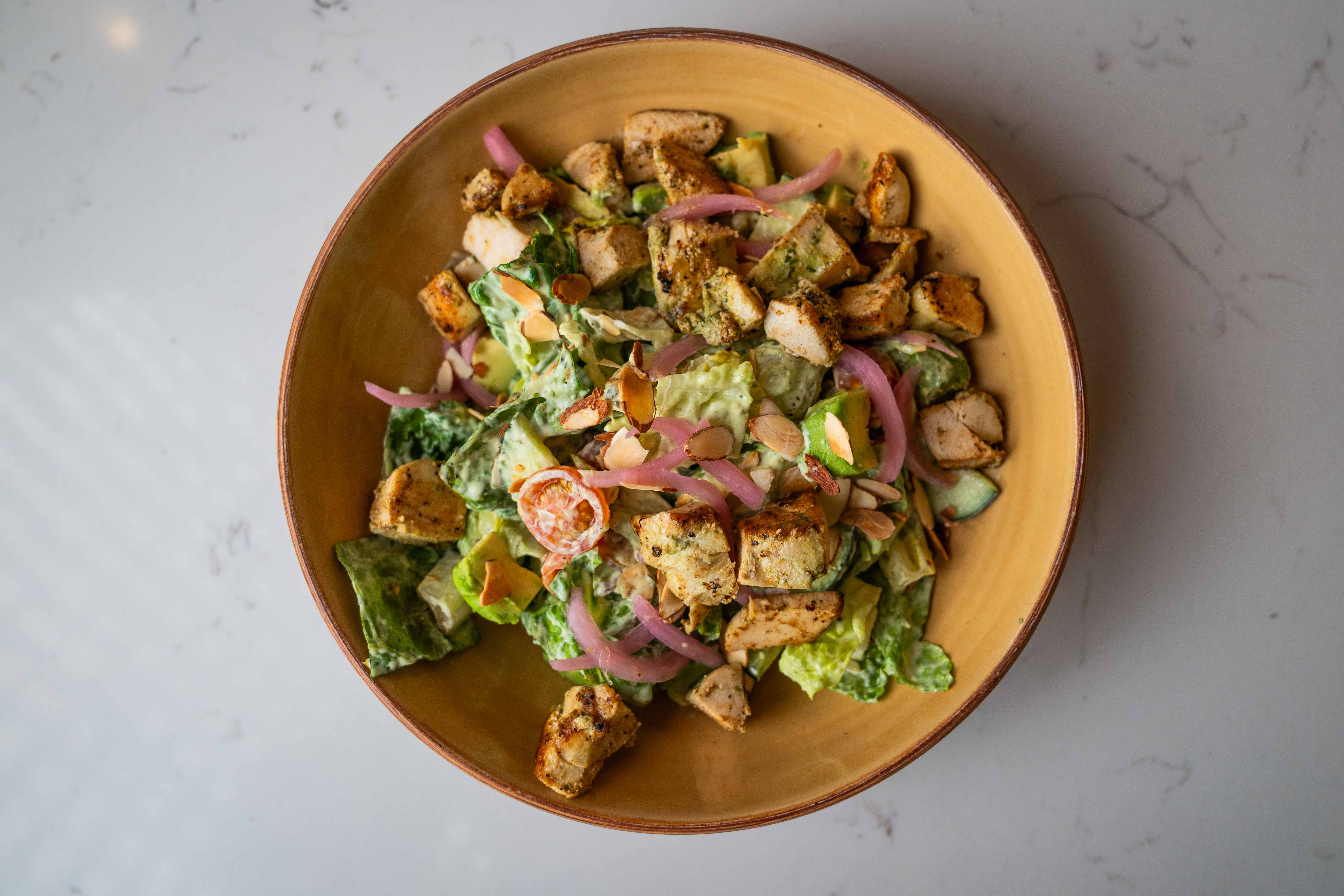 Colorful salad with greens and vegetables served at Joya Kitchen.