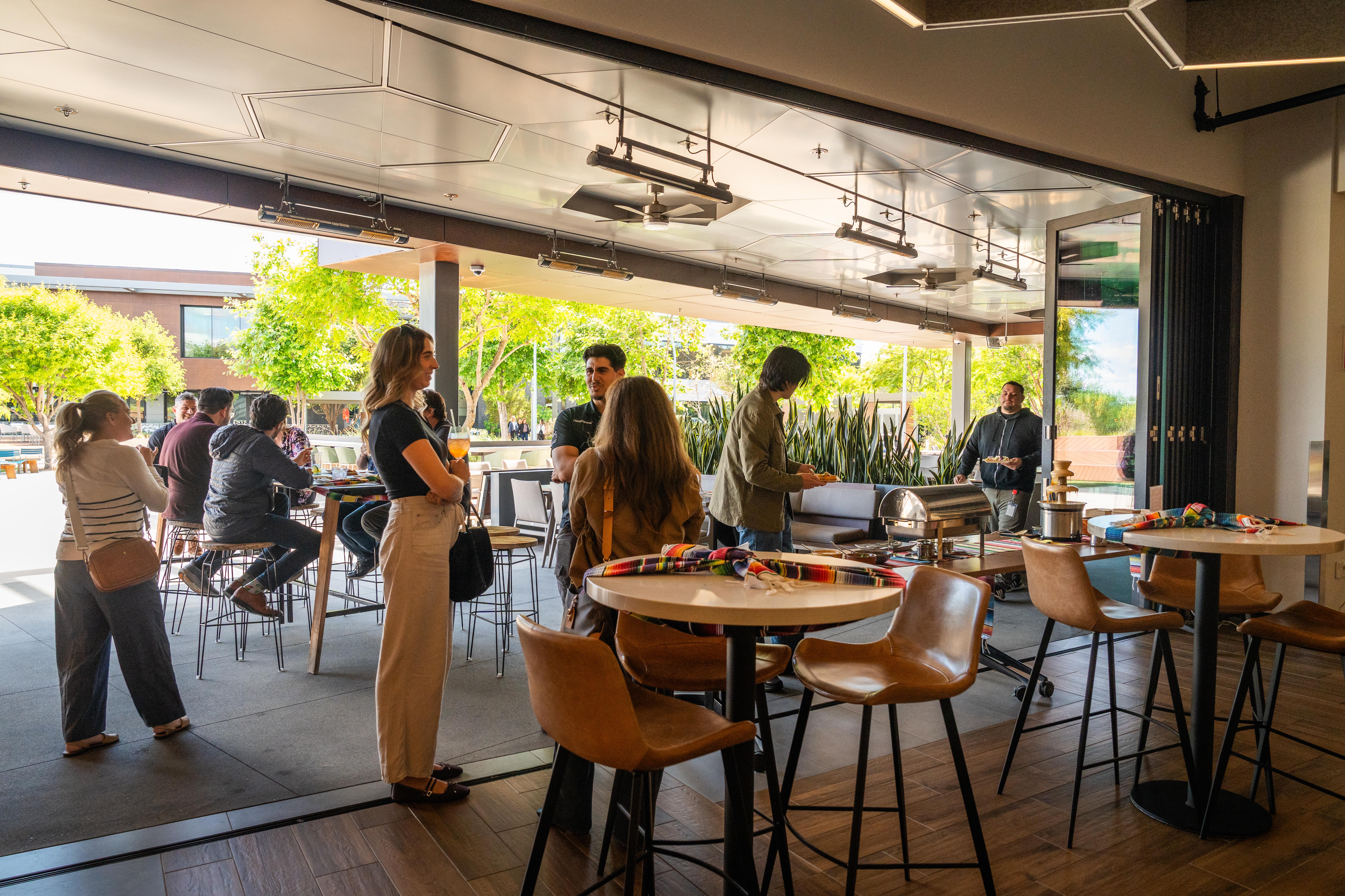 Open patio doors connecting the Joya Kitchen dining room with an outdoor event.