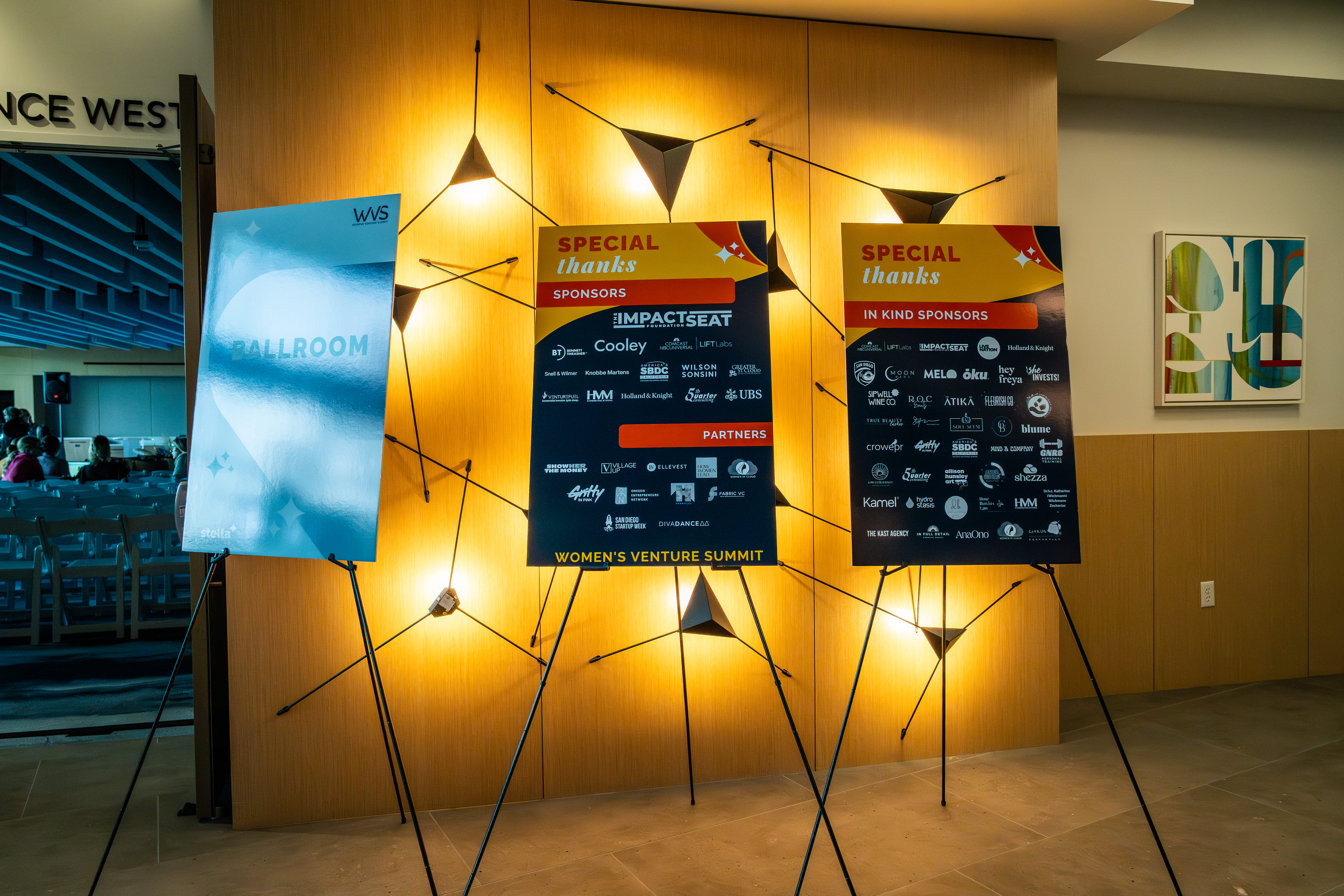 Presentation screens and event information displayed inside a Joya Kitchen meeting space.