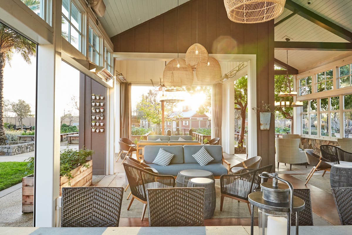 a dining room table in front of a window