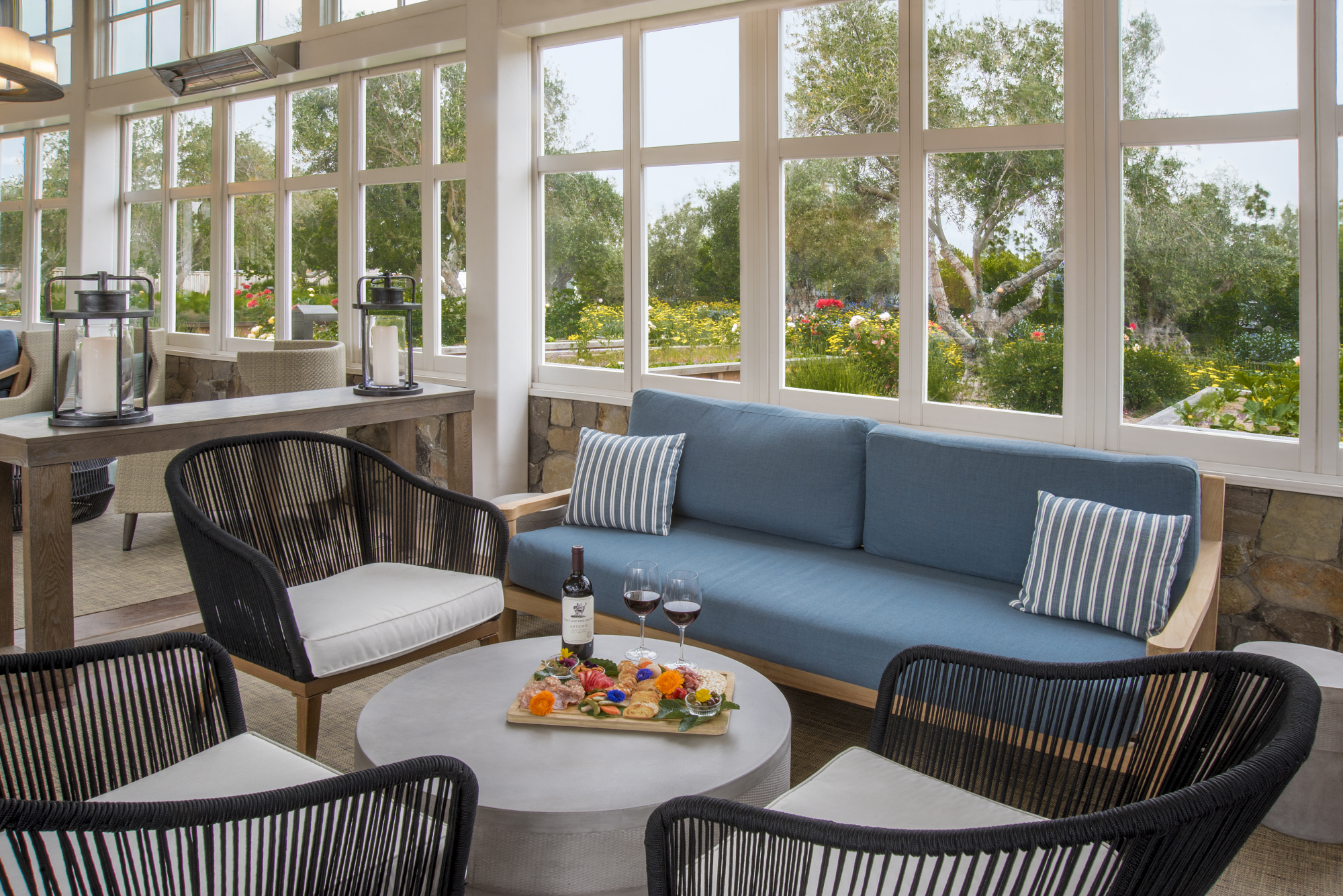 a living room filled with furniture and a large window