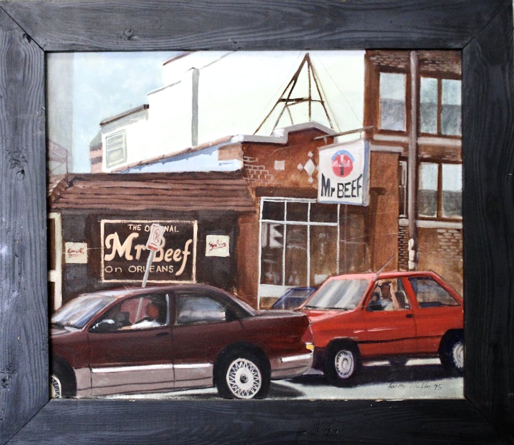 a car parked in front of a brick building