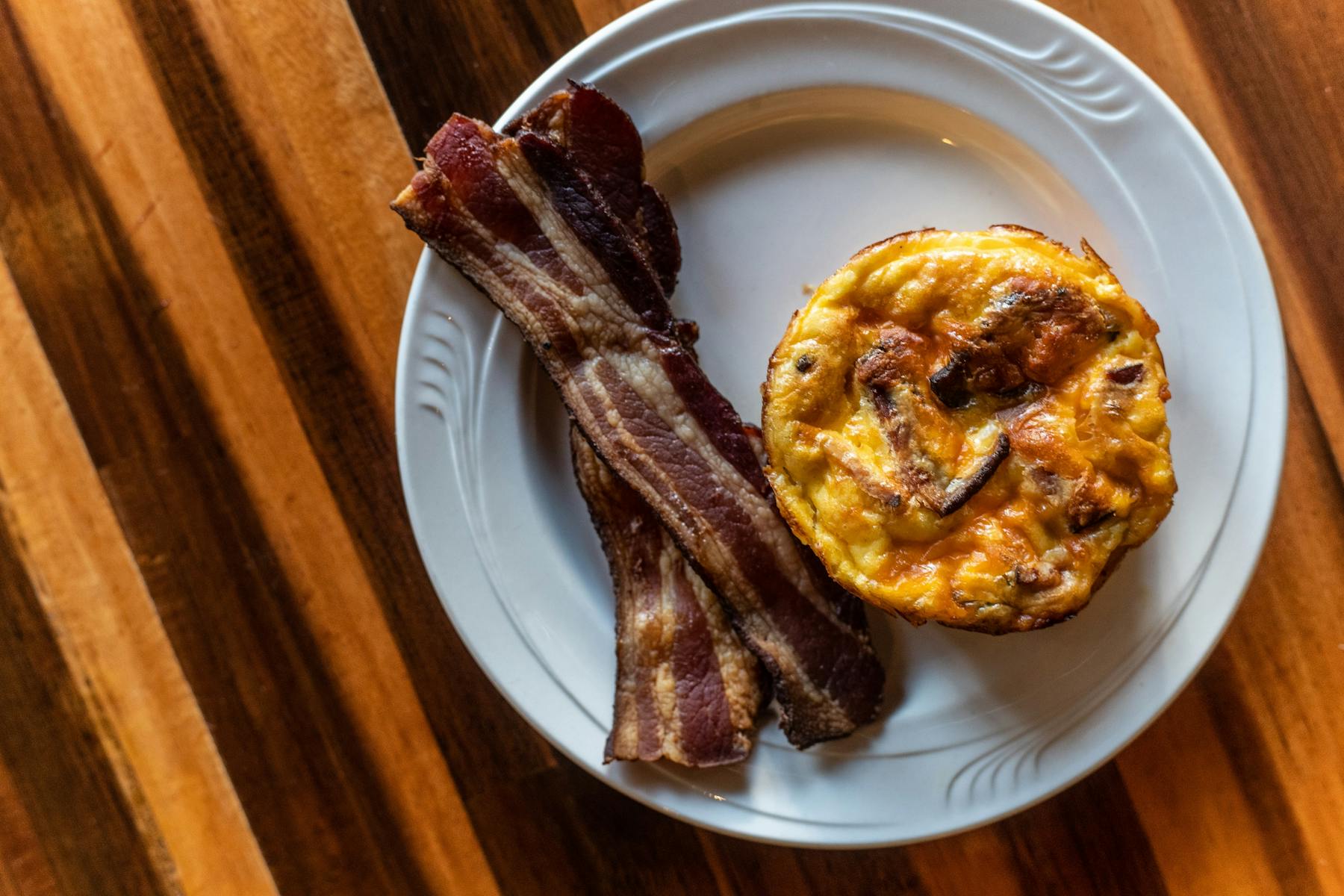 a plate of food sitting on top of a wooden table