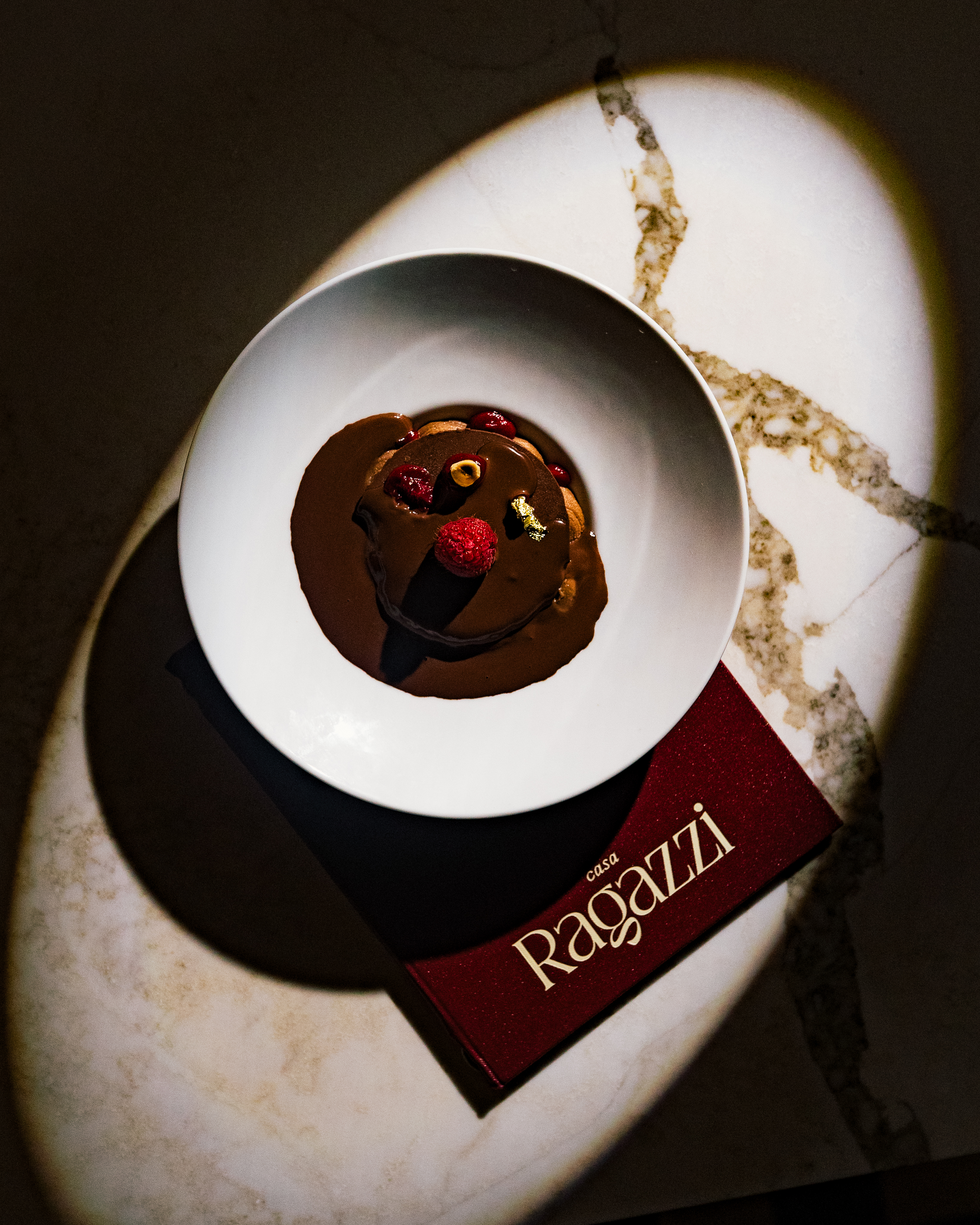 a chocolate doughnut on a plate